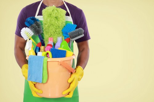 Cleaner wearing PPE while carrying out a safe cleaning task
