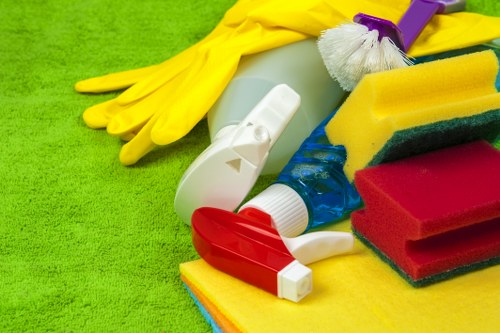 Local technician treating common drink and food stains on a fabric sofa