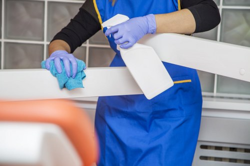 Cleaning a well-used sofa with visible marks in a Harrow property
